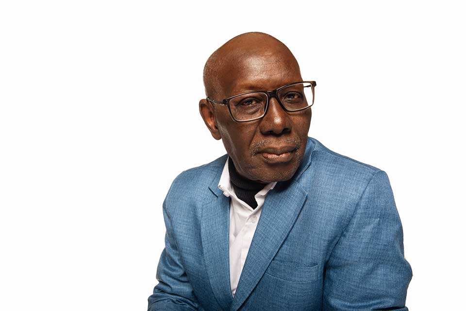 A color photograph of Boubacar Boris Diop juxtaposed against a white background