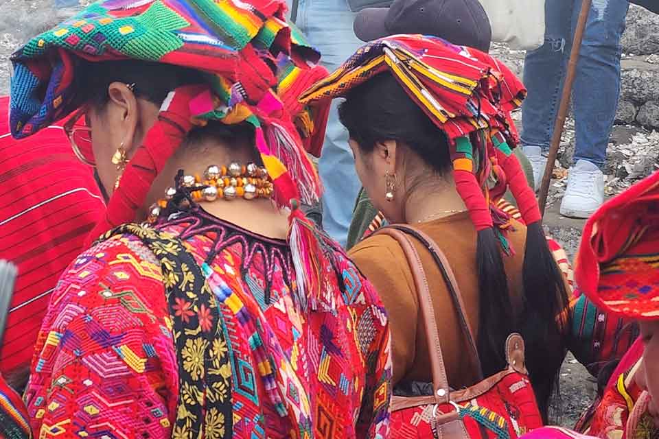 A photograph of indigenous people in bright garb