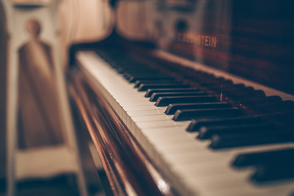 A photograph of a piano keyboard shot from one end