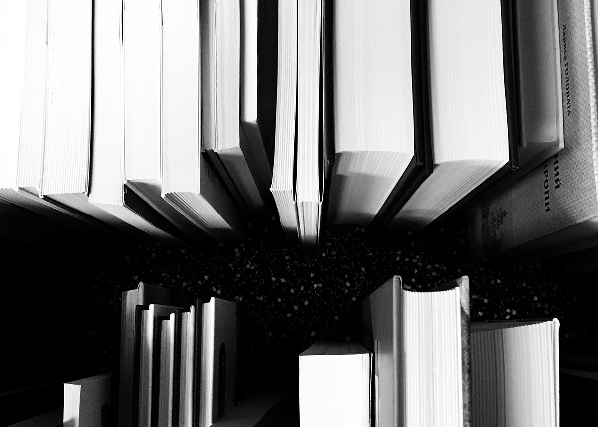 Overhead view of books in black and white