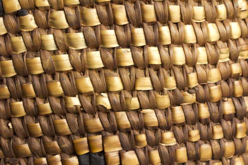 A close-up photograph of a woven basket