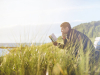 Man reading on a bench