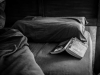 Open book on a bed. Photo by Steve Petrucelli